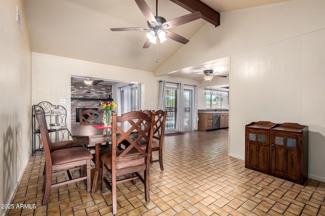 dining area featuring brick floor, baseboards, vaulted ceiling with beams, and ceiling fan