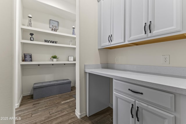 office area featuring dark wood finished floors and baseboards