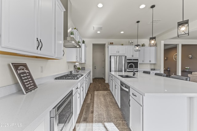 kitchen with a sink, visible vents, appliances with stainless steel finishes, and light countertops