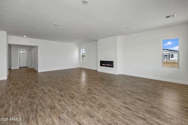 unfurnished living room with hardwood / wood-style flooring