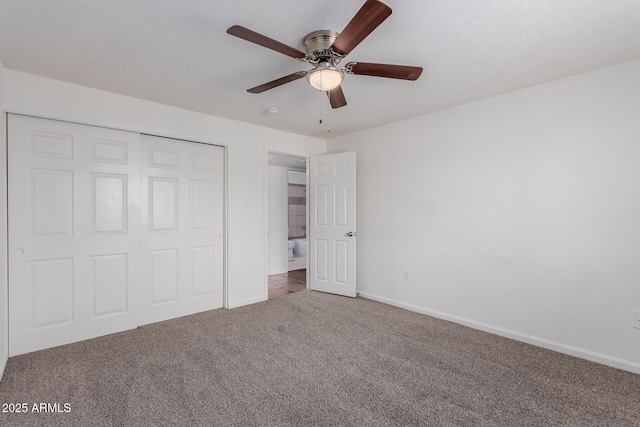 unfurnished bedroom featuring ceiling fan, carpet floors, and a closet