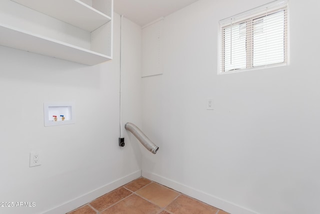 clothes washing area featuring hookup for a washing machine and light tile patterned floors