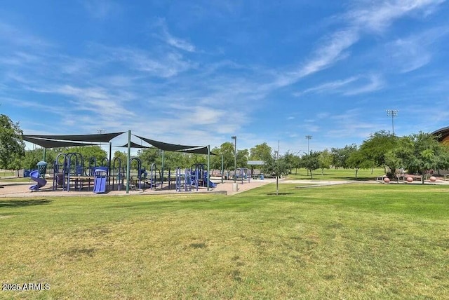 view of playground with a lawn