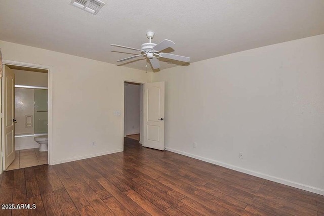 spare room featuring dark hardwood / wood-style flooring