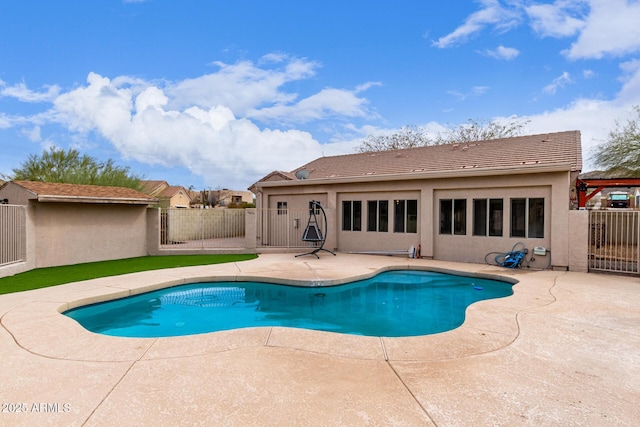 view of pool featuring a patio area, fence, and a fenced in pool