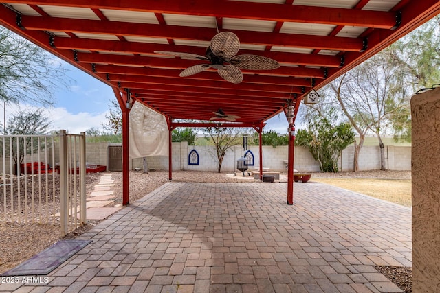 view of patio featuring a fenced backyard and a ceiling fan