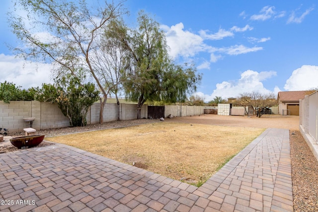 view of yard with a fenced backyard and a patio