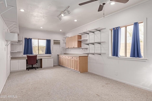 unfurnished office featuring recessed lighting, baseboards, an AC wall unit, and light colored carpet