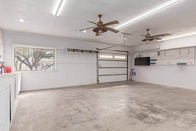 garage with recessed lighting, electric panel, and ceiling fan