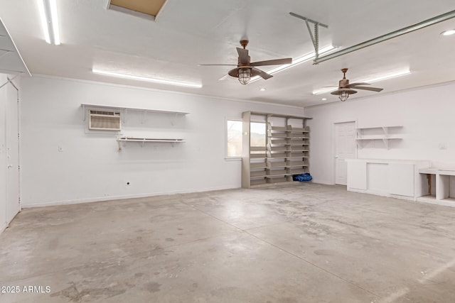 garage with ceiling fan and a wall mounted AC