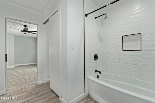 8051 W Mariposa Dr, Phoenix, AZ 85033 - bathroom featuring bathing tub / shower combination, wood finished floors, baseboards, and ceiling fan
