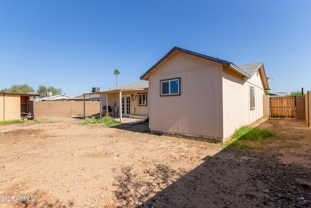 8051 W Mariposa Dr, Phoenix, AZ 85033 - rear view of house with a fenced backyard, french doors, and a patio