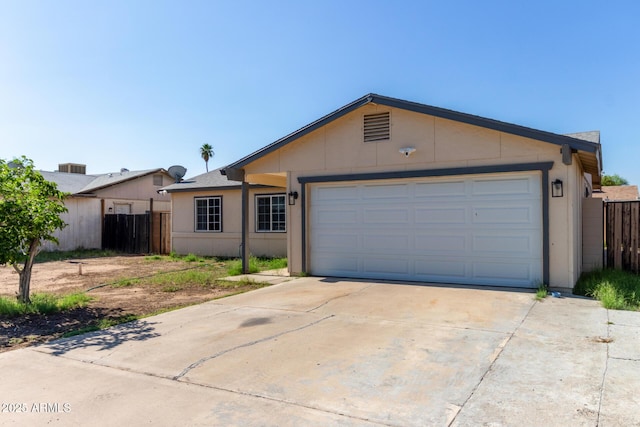 8051 W Mariposa Dr, Phoenix, AZ 85033 - ranch-style home with driveway, an attached garage, and stucco siding