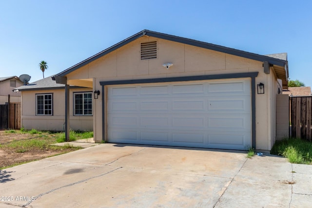 8051 W Mariposa Dr, Phoenix, AZ 85033 - ranch-style home featuring an attached garage, stucco siding, and driveway