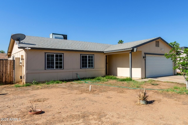8051 W Mariposa Dr, Phoenix, AZ 85033 - ranch-style house with an attached garage, driveway, and roof with shingles