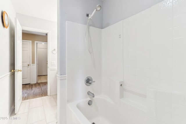 bathroom featuring shower / washtub combination and tile patterned floors