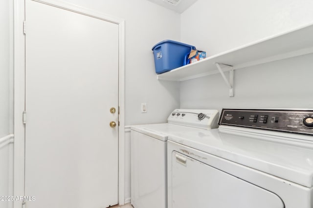 washroom with independent washer and dryer