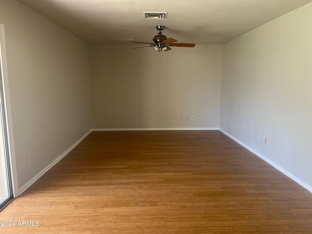 unfurnished room featuring light hardwood / wood-style flooring and ceiling fan