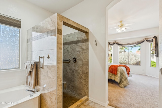 bathroom with ensuite bathroom, a ceiling fan, walk in shower, baseboards, and a bath