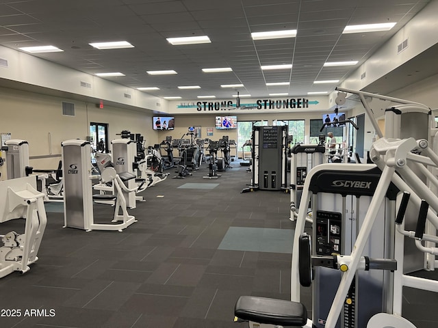 gym with a drop ceiling and visible vents