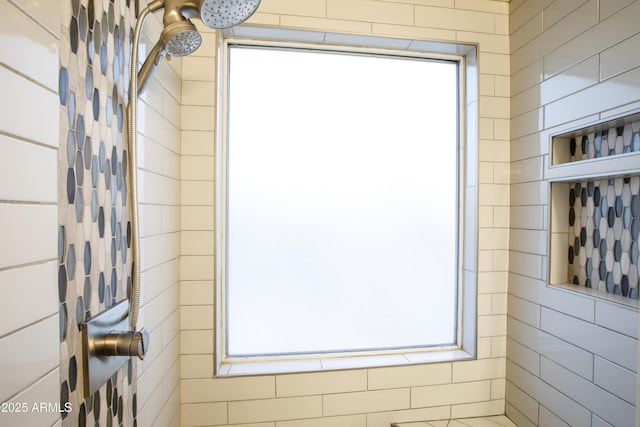 bathroom with tiled shower