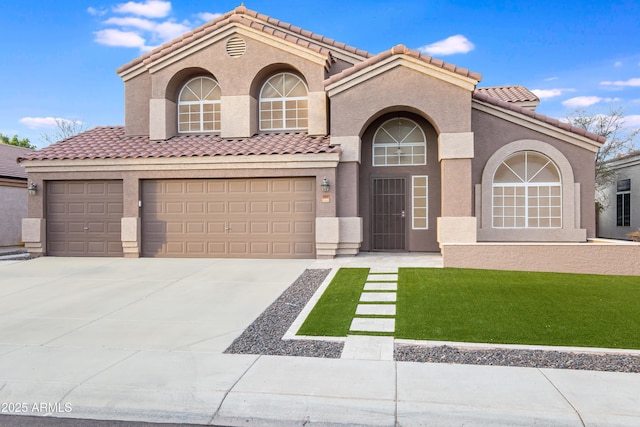 mediterranean / spanish-style house featuring a garage