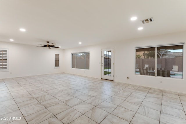 spare room with ceiling fan