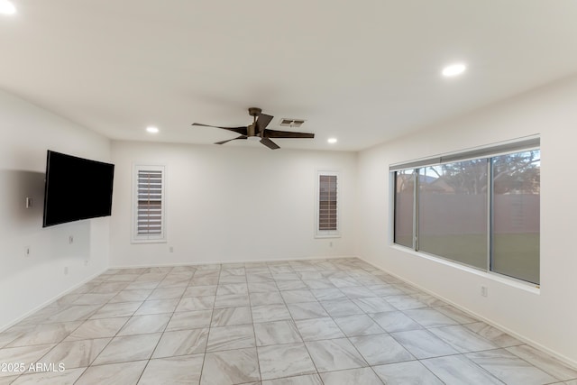 spare room with ceiling fan