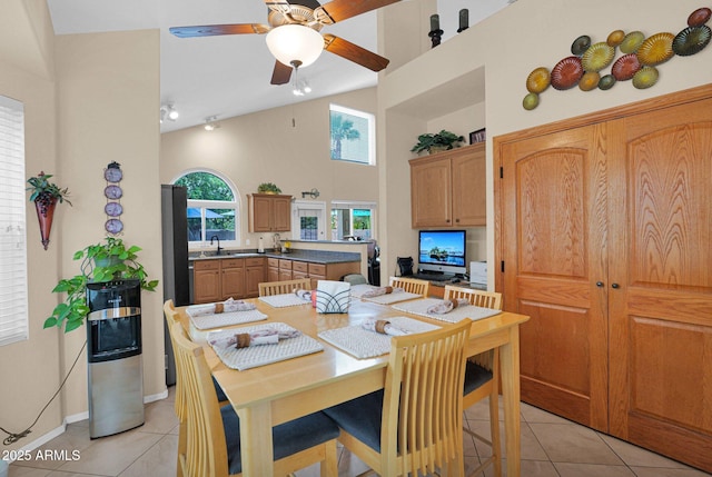 1292 N Renee Ave, Gilbert, AZ 85234 - dining space with light tile patterned floors, a high ceiling, ceiling fan, and baseboards