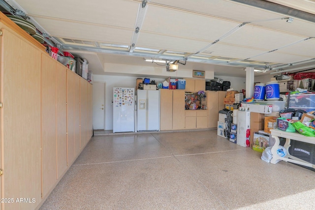 1292 N Renee Ave, Gilbert, AZ 85234 - garage with freestanding refrigerator, white refrigerator with ice dispenser, and a garage door opener