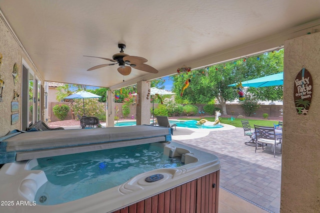 1292 N Renee Ave, Gilbert, AZ 85234 - fenced backyard with a hot tub, a patio, a ceiling fan, and outdoor dining space