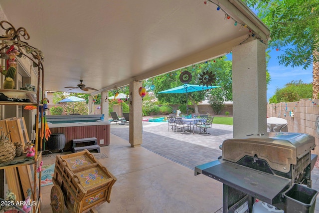 1292 N Renee Ave, Gilbert, AZ 85234 - fenced backyard with a hot tub, a ceiling fan, a patio, and outdoor dining space