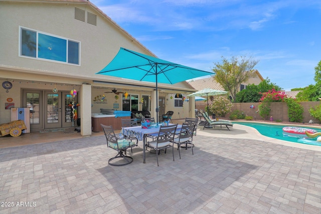 1292 N Renee Ave, Gilbert, AZ 85234 - fenced backyard featuring a patio, french doors, outdoor dining area, a ceiling fan, and a hot tub