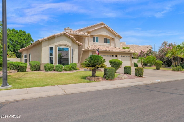 1292 N Renee Ave, Gilbert, AZ 85234 - mediterranean / spanish-style house featuring a tiled roof, stucco siding, a chimney, concrete driveway, and a front yard
