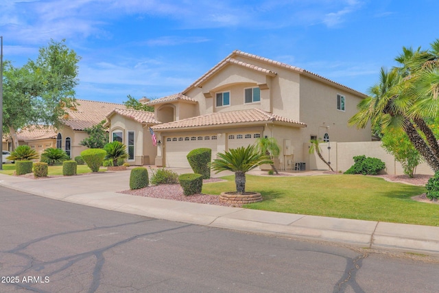 1292 N Renee Ave, Gilbert, AZ 85234 - mediterranean / spanish-style house with stucco siding, a tile roof, concrete driveway, and a front lawn