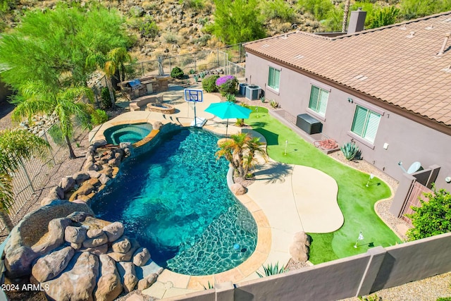 9845 E Inglewood St, Mesa, AZ 85207 - view of pool featuring a patio area, a fenced backyard, a pool with connected hot tub, and central air condition unit