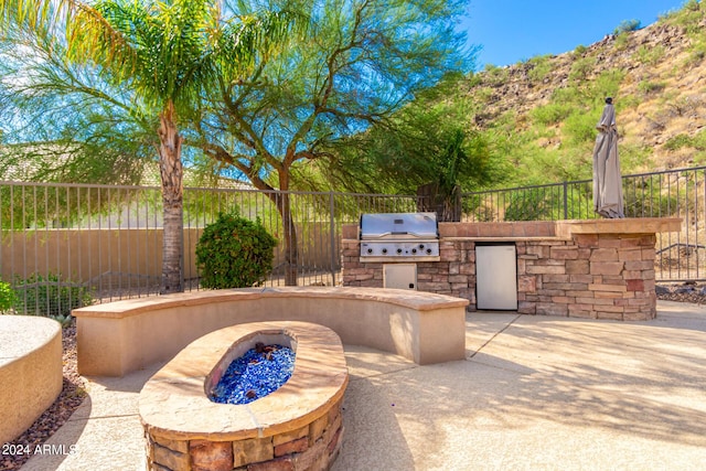 9845 E Inglewood St, Mesa, AZ 85207 - view of patio featuring an outdoor fire pit, a grill, fence, and area for grilling