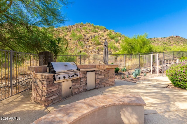 9845 E Inglewood St, Mesa, AZ 85207 - view of patio / terrace with exterior kitchen, a grill, and fence