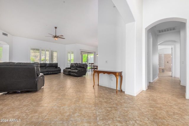 9845 E Inglewood St, Mesa, AZ 85207 - living room featuring arched walkways, visible vents, and a high ceiling