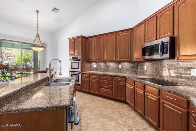 9845 E Inglewood St, Mesa, AZ 85207 - kitchen featuring stainless steel appliances, visible vents, backsplash, a sink, and dark stone counters