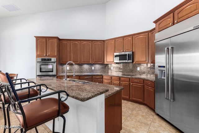 9845 E Inglewood St, Mesa, AZ 85207 - kitchen featuring decorative backsplash, visible vents, stainless steel appliances, and a sink