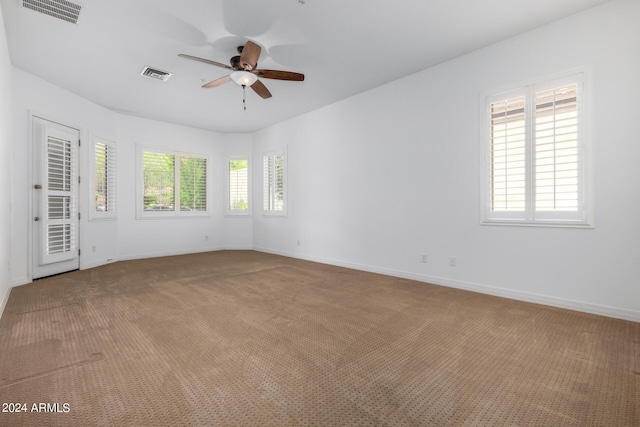 9845 E Inglewood St, Mesa, AZ 85207 - carpeted spare room with a ceiling fan, visible vents, and baseboards