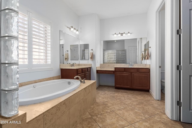 9845 E Inglewood St, Mesa, AZ 85207 - bathroom with toilet, vanity, a bath, and tile patterned floors