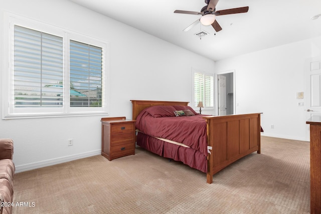 9845 E Inglewood St, Mesa, AZ 85207 - bedroom with light carpet, ceiling fan, visible vents, and baseboards