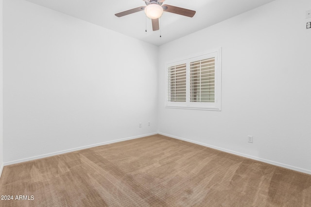 9845 E Inglewood St, Mesa, AZ 85207 - spare room featuring light carpet, a ceiling fan, and baseboards