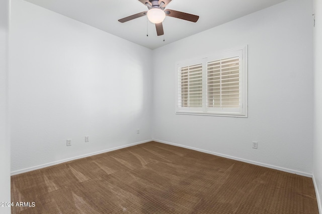 9845 E Inglewood St, Mesa, AZ 85207 - spare room featuring carpet, baseboards, and a ceiling fan
