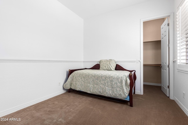 9845 E Inglewood St, Mesa, AZ 85207 - carpeted bedroom featuring baseboards, a walk in closet, and a closet