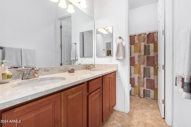 9845 E Inglewood St, Mesa, AZ 85207 - full bath featuring double vanity, tile patterned flooring, a sink, and toilet