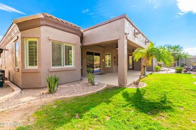 9845 E Inglewood St, Mesa, AZ 85207 - back of house with a patio, a yard, and stucco siding