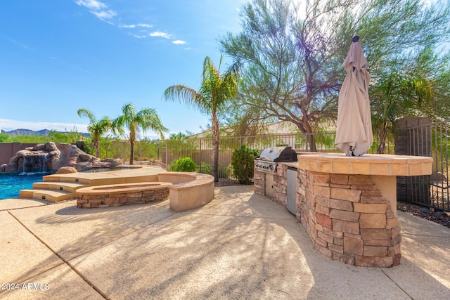 9845 E Inglewood St, Mesa, AZ 85207 - view of patio / terrace featuring a fenced in pool, a hot tub, area for grilling, exterior kitchen, and a fenced backyard
